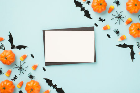 Halloween mockup with blank card on blue background, top viewの写真素材