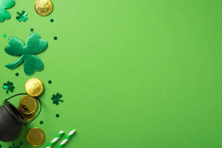 Top view photo of st patrick's day decorations green shamrocks straws clover shaped confetti and pot...