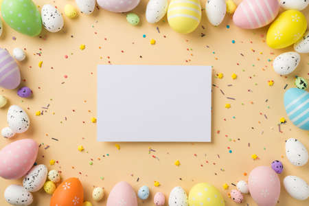 Top view of many multicolored eggs different size with colorful sprinkles in shape of stars and dots...