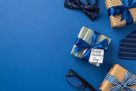father's day concept. Top view photo of gift boxes with ribbon bows postcard blue bow-tie necktie...