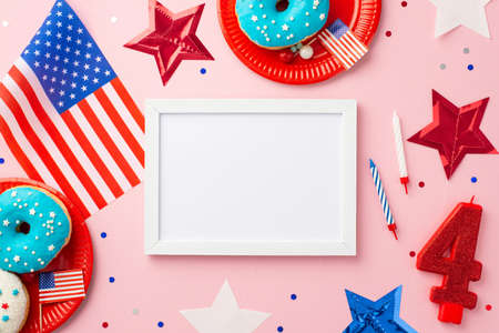 Fourth of July concept. Top view photo of photo frame US national flag stars number 4 candle plates...