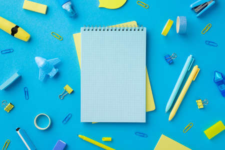 Back to school concept. Top view photo of school accessories adhesive tape sharpeners stapler...