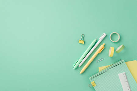 school supplies concept. Top view photo of stationery notepads pens ruler binder clips and adhesive...