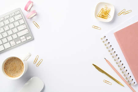 business concept. Top view photo of workplace keyboard computer mouse cup of coffee stationery pink...