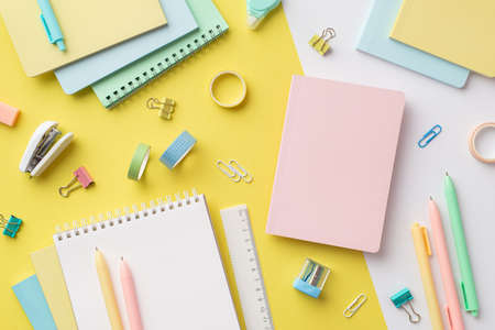 school accessories concept. Top view photo of colorful notebooks sharpener ruler corrector pens...