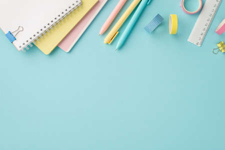 Back to school concept. Top view photo of school accessories stack of diaries colorful pens adhesive...