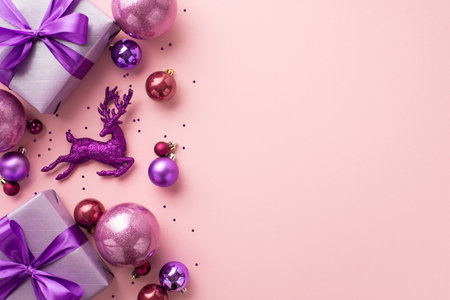 christmas concept. Top view photo of purple gift boxes with ribbon bows pink violet baubles reindeer ornament and confetti on isolated pastel pink background with copyspaceの写真素材