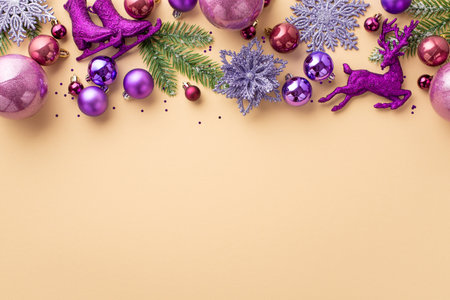 Christmas tree decoration concept. Top view photo of pink and violet baubles deer ice skates flower snowflake ornaments pine branches and confetti on isolated pastel beige background with blank spaceの写真素材