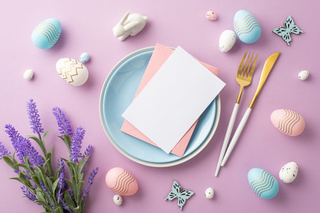 Easter concept. Top view photo of blue plate with pink envelope letter cutlery colorful easter eggs ceramic bunny butterflies and bouquet of lavender on isolated lilac background with copyspaceの写真素材