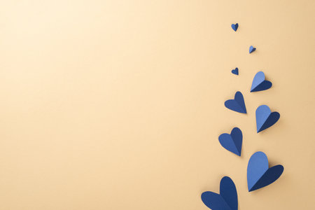 Honor your dad on Father's Day with a top view of flying hearts composition on a beige background featuring an empty space for text or adsの写真素材