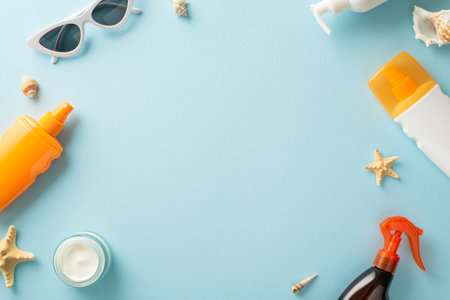 Healthy summer tan concept. Above view photo of empty space surrounded by sunscreen bottles, tubes,...