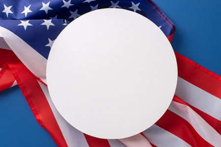 Labor Day in USA concept. Above view photo of empty round frame with the flag of United States of America on blue isolated background with copy-spaceの写真素材