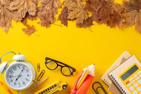 Essential back-to-school tools: Top view of stationery items, such as diaries, alarm clock, pencil...