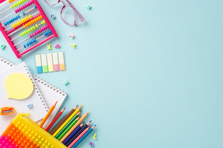 Delightful educational essentials arranged in a top view composition: a vivid assortment of colorful...