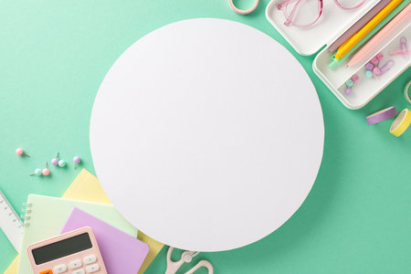 Welcome new academic season with captivating back-to-school concept. From top view, see collection of feminine stationery in pencil case on teal backdrop, empty circle ready for text or promo messagesの写真素材