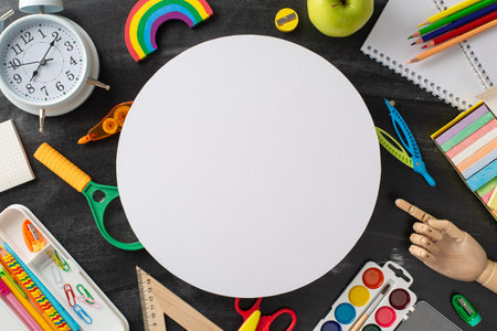 Experience the charm of lecture hall through this top view composition: blackboard adorned with variety of stationery on an isolated background, offering copyspace for adverts or textの写真素材