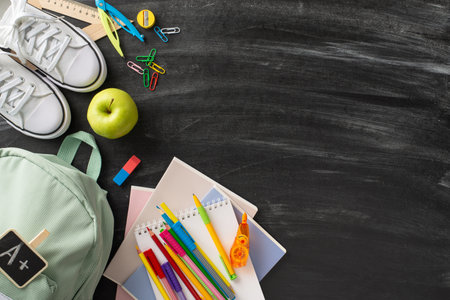 academic preparation scene. Top view photo of white rucksack and sneakers, and an ample supply of...