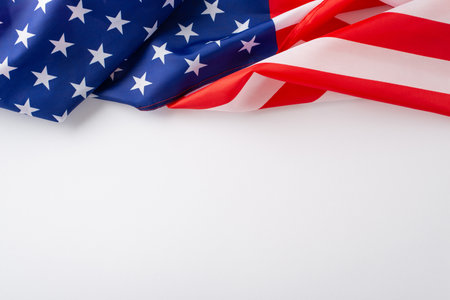 Celebrating the essence of the public holiday: Embrace the occasion with this top-view photo, highlighting the American flag on white isolated background. Perfect for ads or text overlaysの写真素材