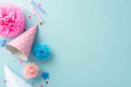 Uplifting festivity concept. Flat lay top view image featuring table set with celebratory embellishments, candies, celebration headgear, candles, confetti, against light blue backdrop for text or adsの写真素材