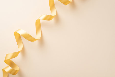 Top view photo of empty space with a beige ribbon on isolated light beige background with copyspaceの写真素材