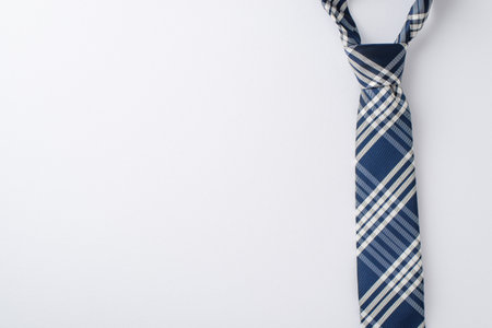 Ready for a Father's Day festivity? Top-down view of an elegant tie on white, ideal for your personalized greeting or promotionの写真素材
