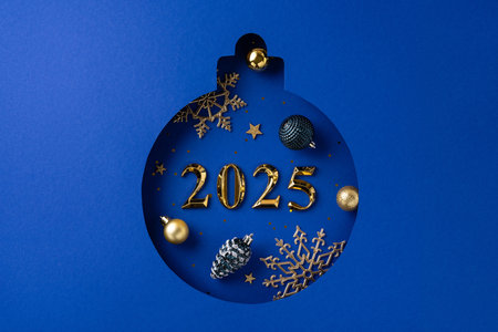 Stylish 2025 Christmas ornament featuring gold decorations on a vibrant blue background. Perfect for holiday celebrations and seasonal greetingsの写真素材