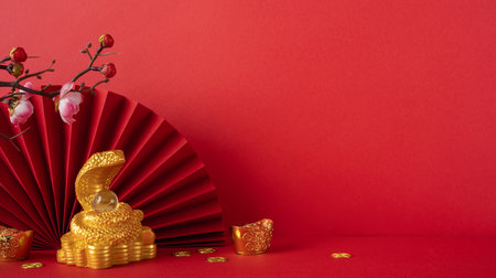 A vibrant red background featuring a gold snake with coins, cherry blossoms, and traditional elements symbolizing Chinese New Year 2025 celebrationの写真素材