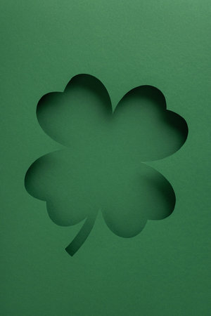 Cutout of a four-leaf clover designed in vertical green tones celebrating Irish culture and luckの写真素材