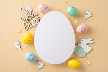 Easter-themed arrangement featuring pastel eggs, bunny decorations, and a blank central egg shapeの写真素材