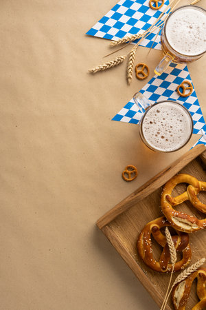 Festive Oktoberfest vertical arrangement featuring cold beer, pretzels, wheat decor, and a Bavarian blue and white pattern in celebration of German cultureの写真素材
