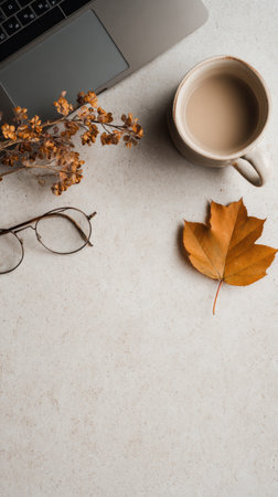 Rustic desk with warm brown tones featuring a coffee cup, dried leaves, and autumn vibes. Generated A.I.の素材