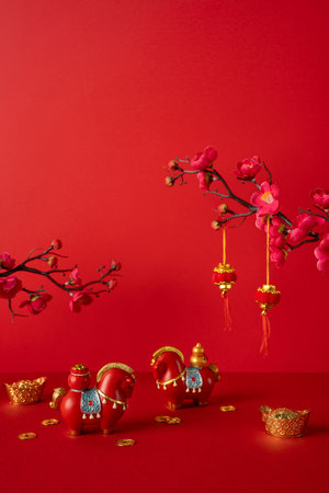 Side vertical view. Red backdrop with gold ingots and coins, festive horses, and plum blossoms. Bright lanterns hang, symbolizing celebration, prosperity, luck, and blessingsの写真素材