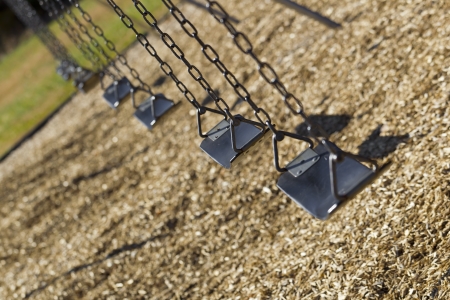 A set of empty playground swingsの写真素材