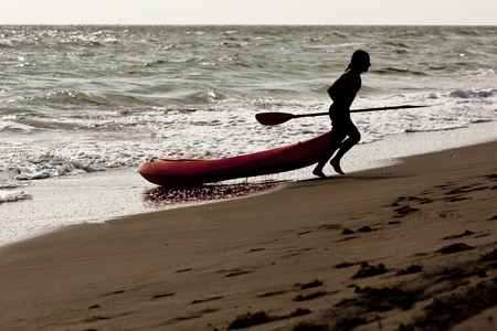 Lifeguards practice their lifesaving skills in the oceanの写真素材