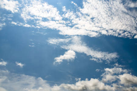 A blue sky with small cloud formations