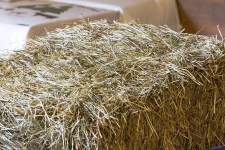 A bale of hay inside a barn