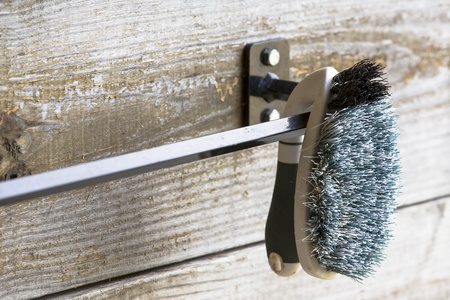 An equestrian scrub brush inside a barnの写真素材