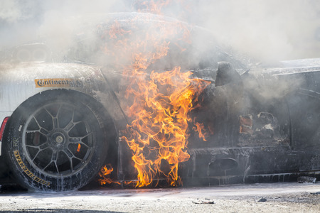 Sebring, FL - Mar 15, 2014:  The Riley Motorsport Dodge ViperExchange.com goes up in flames after a crash early in the 12 Hours of Sebring at Sebring International Raceway in Sebring, FL.のeditorial素材