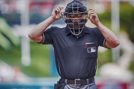 Anaheim, CA - Apr 13, 2014: Home plate umpire, Toby Basner, calls the plays against the LA Angels at Angels Stadium at Anaheim in Anaheim, CA.  The Angels went on to win the game, 14-2.  のeditorial素材