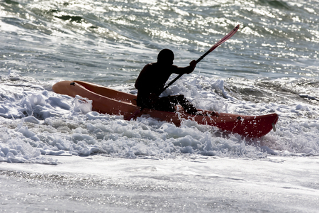 Lifeguards practice their lifesaving skills in the oceanの写真素材