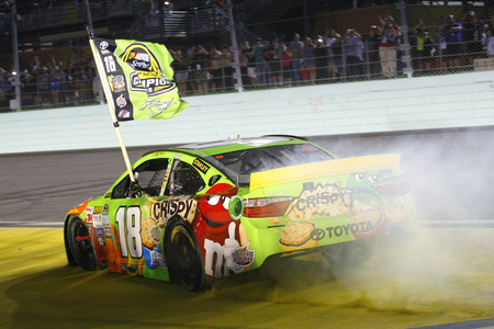 Homestead, FL - Nov 23, 2015: Kyle Busch (18) wins the 2015 NASCAR Sprint Cup Championship following the FORD EcoBoost 400 at Homestead Miami Speedway in Homestead, FL.のeditorial素材