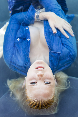 A blonde model in a poolの写真素材
