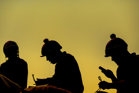 Images of horses and their riders at a horse raceの写真素材