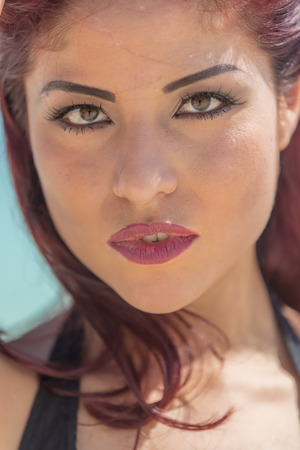 A hispanic brunette model enjoying the beachの写真素材