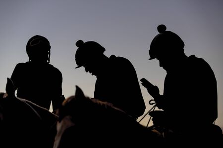 Images of horses and their riders at a horse raceの写真素材