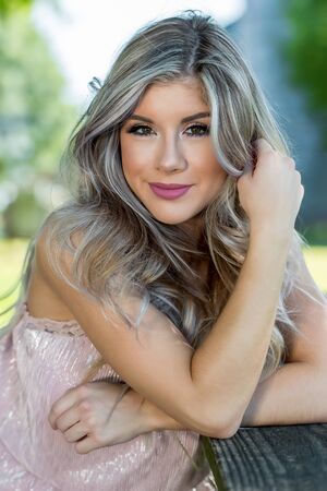 A young brunette model enjoying a day at the park.の写真素材