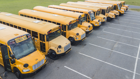 School buses prepare for another school year.のeditorial素材
