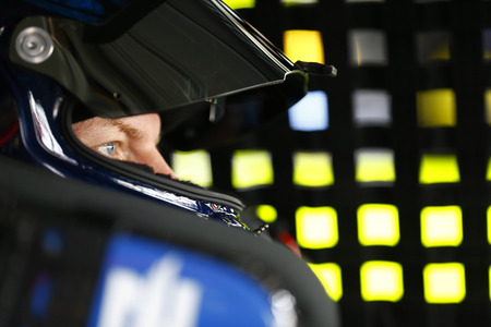 September 30, 2017 - Dover, Delaware, USA: Dale Earnhardt Jr. (88) straps into his car to practice for the Apache Warrior 400 at Dover International Speedway in Dover, Delaware.のeditorial素材