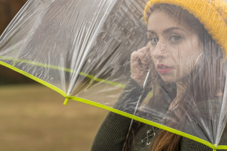 A beautiful brunette model enjoying the autumn weatherの写真素材