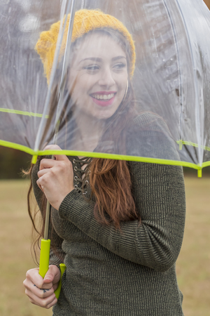 A beautiful brunette model enjoying the autumn weatherの写真素材